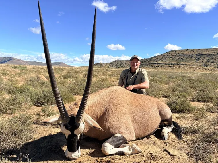 Hunter with a gemsbok trophy in the Eastern Cape of South Africa