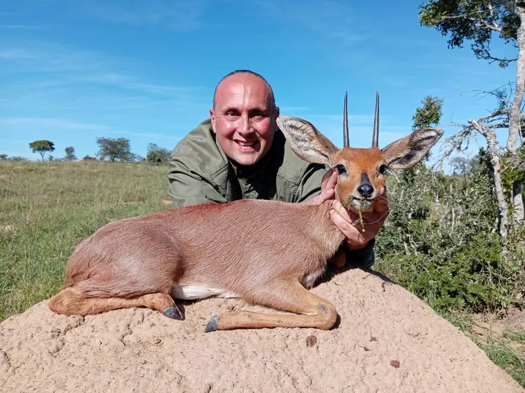 Hunter with a small antelope trophy in the Eastern Cape