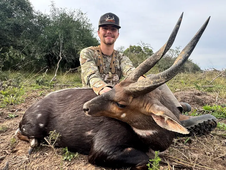 Hunter with a mature spiral horned trophy in the Eastern Cape