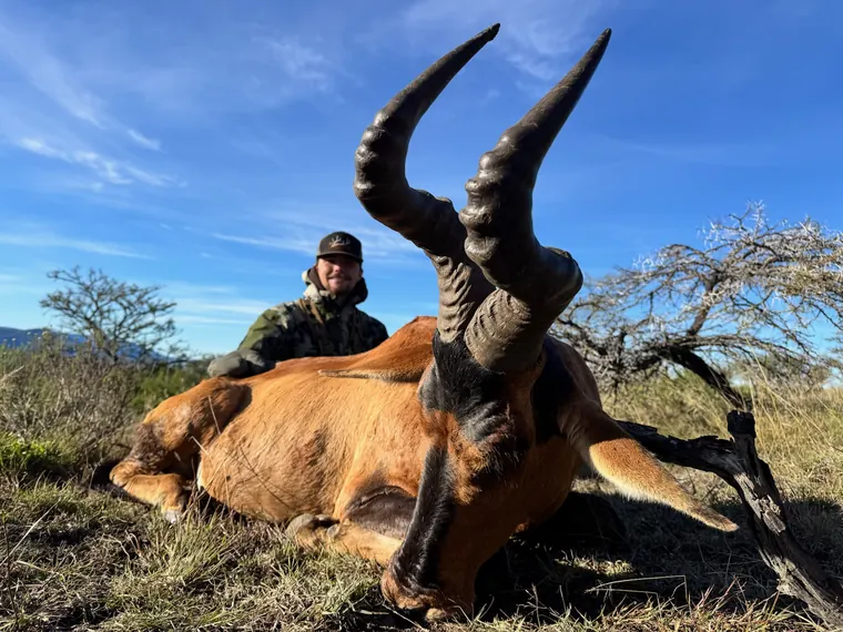 Hunter with a mature plains game trophy in golden South African light