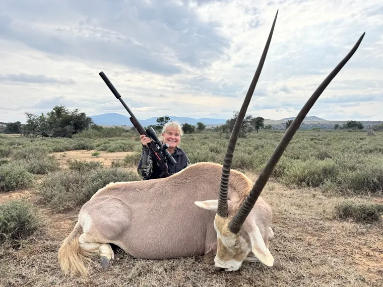 Hunter with a long horned gemsbok trophy in South Africa