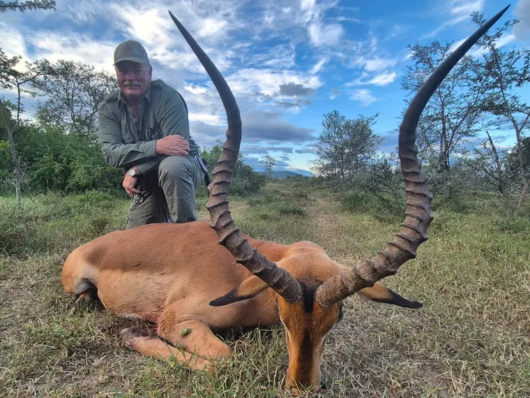 Hunter with a mature impala trophy in South Africa