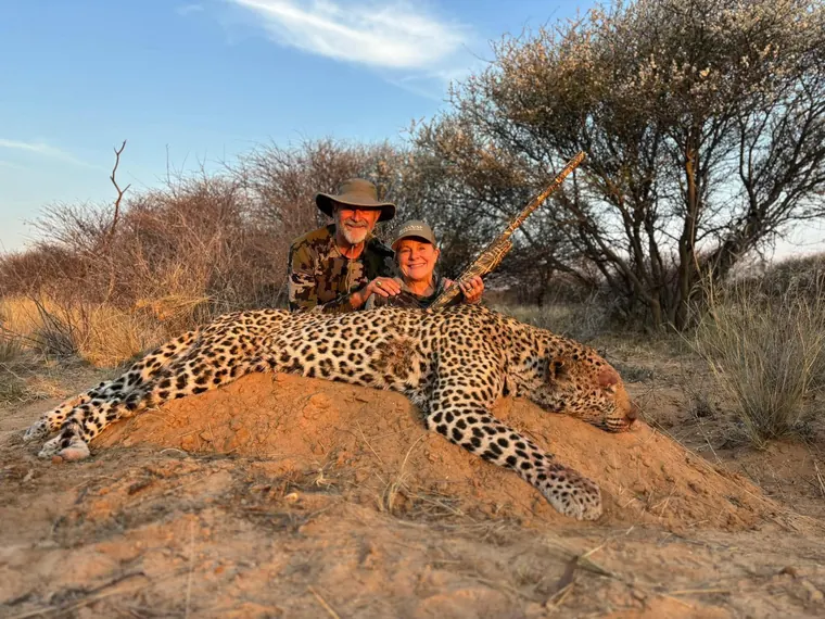 Hunters with a leopard from the Botswana album
