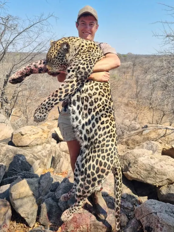 Hunters with a leopard from the Botswana album