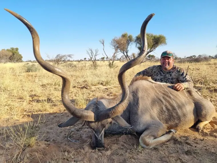 Hunter with a kudu from the Botswana album