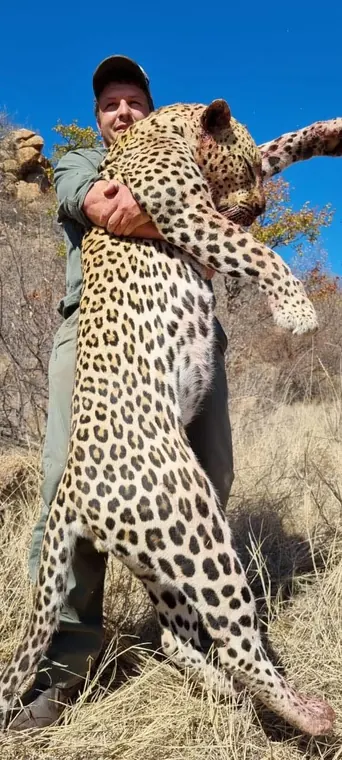Hunters with a leopard from the Botswana album