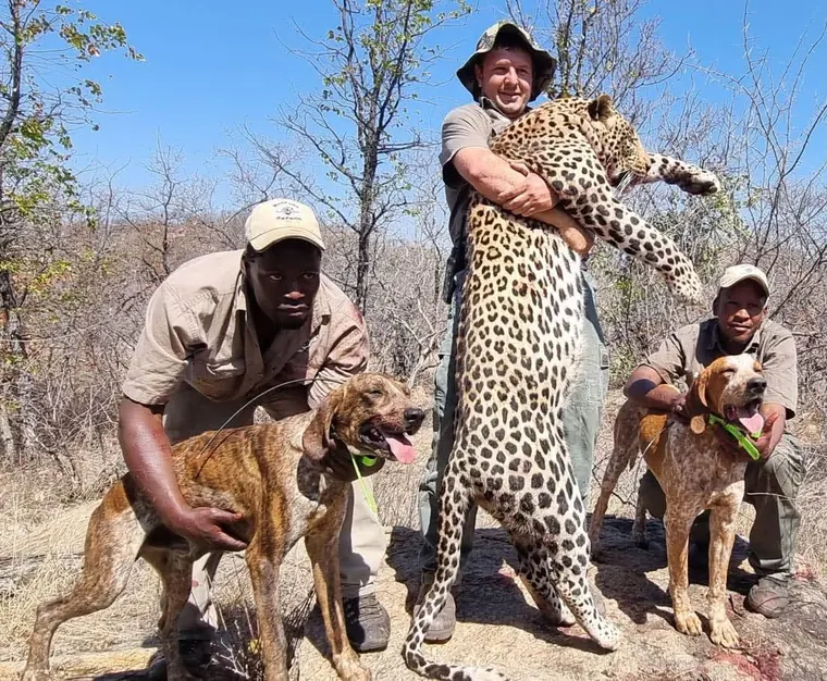 Hunters with a leopard from the Botswana album