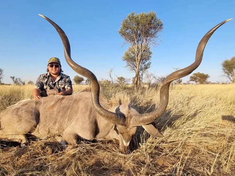 Hunter with a kudu from the Botswana album
