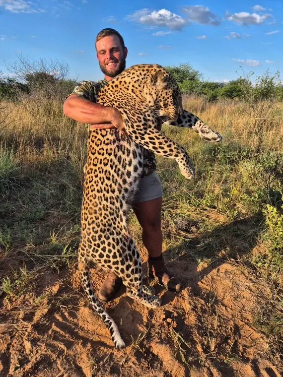 Hunters with a leopard from the Botswana album